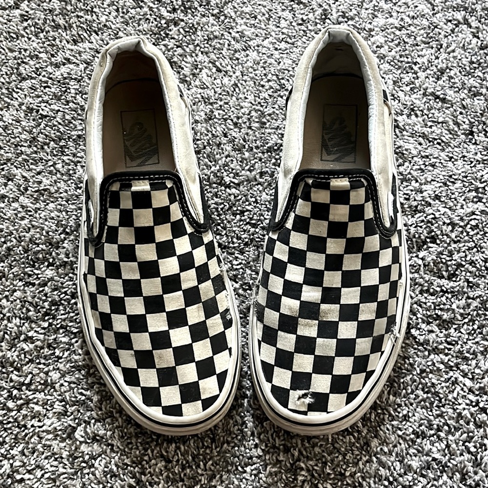 These shoes are the black and white checkered shoes. They are buy the brand van.
